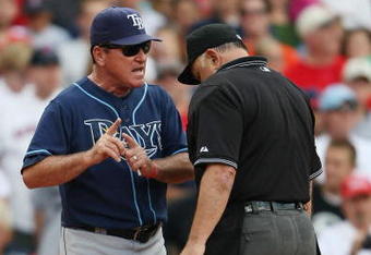 BOSTON - SEPTEMBER 13:  Manager Joe Maddon #70 of the Tampa Bay Rays discusses a call with home plate umpire Randy Marsh in the seventh inning against the Boston Red Sox on September 13, 2009 at Fenway Park in Boston, Massachusetts.  (Photo by Elsa/Getty Images)