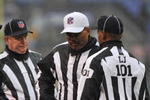 BALTIMORE - DECEMBER 13:  Head coach John Harbaugh of the Baltimore Ravens talks with the referees about a call during the game against the Detroit Lions at M&T Bank Stadium on December 13, 2009 in Baltimore, Maryland. The Ravens defeated the Lions 48-3. (Photo by Larry French/Getty Images)