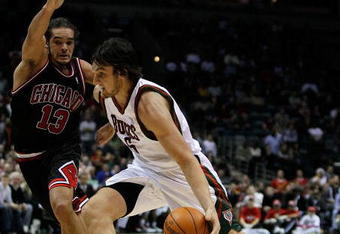 MILWAUKEE - NOVEMBER 30: Andrew Bogut #6 of the Milwuakee Bucks drives around Joakim Noah #13 of the Chicago Bulls at the Bradley Center on November 30, 2009 in Milwaukee, Wisconsin. The Bucks defeated the Bulls 99-97. NOTE TO USER: User expressly acknowledges and agrees that, by downloading and/or using this Photograph, User is consenting to the terms and conditions of the Getty Images License Agreement. (Photo by Jonathan Daniel/Getty Images)