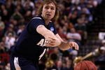 PORTLAND, OR - MARCH 19:  Steve McNees #4 of the Akron Zips passes the ball against the Gonzaga Bulldogs in the first half during the first round of the NCAA Division I Men's Basketball Tournament at the Rose Garden on March 19, 2009 in Portland, Oregon.  (Photo by Jonathan Ferrey/Getty Images)