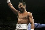 LAS VEGAS - FEBRUARY 10:  Shane Mosley (L) celebrates as he walks back to his corner after the second round of his interim WBC welterweight title fight against Luis Collazo (R) at the Mandalay Bay Events Center February 10, 2007 in Las Vegas, Nevada. Mosley won in a unaminous decision.  (Photo by Ethan Miller/Getty Images)