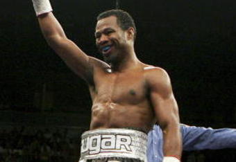 LAS VEGAS - FEBRUARY 10:  Shane Mosley (L) celebrates as he walks back to his corner after the second round of his interim WBC welterweight title fight against Luis Collazo (R) at the Mandalay Bay Events Center February 10, 2007 in Las Vegas, Nevada. Mosley won in a unaminous decision.  (Photo by Ethan Miller/Getty Images)