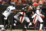 CLEVELAND - JANUARY 03:  Joshua Cribbs #16 of the Cleveland Browns runs by Derek Cox #21 and Michael Coe #26 of the Jacksonville Jaguars at Cleveland Browns Stadium on January 3, 2010 in Cleveland, Ohio.  (Photo by Matt Sullivan/Getty Images)