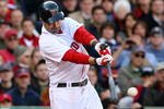 BOSTON - OCTOBER 11:  Mike Lowell #25 of the Boston Red Sox hits a RBI single in the eighth inning against the Los Angeles Angels of Anaheim in Game Three of the ALDS during the 2009 MLB Playoffs at Fenway Park on October 11, 2009 in Boston,  Massachusetts. (Photo by Jim Rogash/Getty Images)