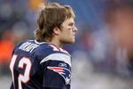 FOXBORO, MA - JANUARY 10:  Tom Brady #12 of the New England Patriots looks on from the bench dejected against the Baltimore Ravens during the 2010 AFC wild-card playoff game at Gillette Stadium on January 10, 2010 in Foxboro, Massachusetts.  (Photo by Al Bello/Getty Images)