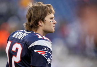 FOXBORO, MA - JANUARY 10:  Tom Brady #12 of the New England Patriots looks on from the bench dejected against the Baltimore Ravens during the 2010 AFC wild-card playoff game at Gillette Stadium on January 10, 2010 in Foxboro, Massachusetts.  (Photo by Al Bello/Getty Images)