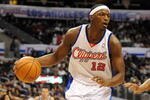 LOS ANGELES, CA - DECEMBER 13:  Al Thornton #12 of the Los Angeles Clippers is guarded by Keith Bogans #10 of the San Antonio Spurs at Staples Center on December 13, 2009 in Los Angeles, California.  NOTE TO USER: User expressly acknowledges and agrees that, by downloading and/or using this Photograph, user is consenting to the terms and conditions of the Getty Images License Agreement.  (Photo by Harry How/Getty Images)
