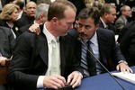 WASHINGTON - MARCH 17:  Former St. Louis Cardinal Mark McGwire (L) talks with Rafael Palmeiro of the Baltimore Orioles during a House Committe session investigating Major League Baseball's effort to eradicate steroid use on Capital Hill March 17, 2005 in Washington, DC. McGwire and Palmeiro were named in the Mitchell Report that was released December 13, 2007 by a committee looking into use of performance-enhancing drugs in Major League Baseball and headed by former Senate Majority Leader George Mitchell.  (Photo by Mark Wilson/Getty Images)