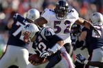 FOXBORO, MA - JANUARY 10:  Tom Brady #12 of the New England Patriots atempts to duck the pass rush of Ray Lewis #52 of the Baltimore Ravens during the 2010 AFC wild-card playoff game at Gillette Stadium on January 10, 2010 in Foxboro, Massachusetts. The Ravens won 33-14. (Photo by Al Bello/Getty Images)