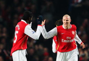 LONDON - FEBRUARY 11:  Philippe Senderos (R) of Arsenal celebrates with team mate Emmanuel Adebayor (L) after opening the scoring during the Barclays Premier League match between Arsenal and Blackburn Rovers at the Emirates Stadium on February 11, 2008 in London, England.  (Photo by Clive Mason/Getty Images)
