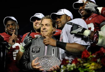 PASADENA, CA - JANUARY 07:  Head coach Nick Saban and the Alabama Crimson Tide celebrate with the BCS Championship trophy after winning the Citi BCS National Championship game over the Texas Longhorns at the Rose Bowl on January 7, 2010 in Pasadena, California. The Crimson Tide defeated the Longhorns 37-21.  (Photo by Kevork Djansezian/Getty Images)