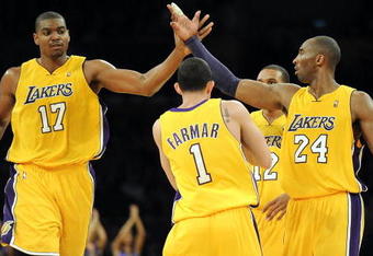 LOS ANGELES, CA - JANUARY 05:  Andrew Bynum #17, Kobe Bryant #24, Jordan Farmar #1 and Shannon Brown #12 of the Los Angeles Lakers celebrate a score on way to an 88-79 win over the Houston Rockets during the second half at Staples Center on January 5, 2010 in Los Angeles, California.  NOTE TO USER: User expressly acknowledges and agrees that, by downloading and/or using this Photograph, user is consenting to the terms and conditions of the Getty Images License Agreement.  (Photo by Harry How/Getty Images)