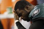ARLINGTON, TX - JANUARY 9:  Quarterback Michael Vick #7 of the Philadelphia Eagles looks down on the bench late in the fourth quarter against the Dallas Cowboys during the 2010 NFC wild-card playoff game at Cowboys Stadium on January 9, 2010 in Arlington, Texas. (Photo by Jamie Squire/Getty Images)
