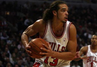 CHICAGO - NOVEMBER 03: Joakim Noah #13 of the Chicago Bulls looks to pass after grabbing a rebound against the Milwaukee Bucks at the United Center on November 3, 2009 in Chicago, Illinois. The Bulls defeated the Bucks 83-81. (Photo by Jonathan Daniel/Getty Images)