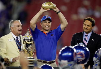 GLENDALE, AZ - JANUARY 04:  Head coach Chris Petersen of the Boise State Broncos celebrates after defeating the TCU Horned Frogs 17-10 during the Tostitos Fiesta Bowl at the Universtity of Phoenix Stadium on January 4, 2010 in Glendale, Arizona.  (Photo by Jamie Squire/Getty Images)