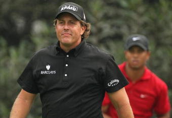 SHANGHAI, CHINA - NOVEMBER 08:  Phil Mickelson of the USA watches the tee shot of Tiger Woods (R) on the fourth hole during the final round of the WGC - HSBC Champions at Sheshan International Golf Club on November 8, 2009 in Shanghai, China.  (Photo by Ross Kinnaird/Getty Images)