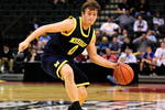 ORLANDO, FL - NOVEMBER 27:  Zack Novak #0 of the Michigan Wolverines attempts a pass against the Marquette Golden Eagles during the Old Spice Classic at Disney's Milk House on November 27, 2009 in Orlando, Florida. Marquette defeated Michigan 79-65.  (Photo by Sam Greenwood/Getty Images)