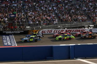 FONTANA, CA - OCTOBER 11:  Jimmie Johnson, driver of the #48 Lowe's/Jimmie Johnson Foundation Chevrolet, leads the field at the final restart of the NASCAR Sprint Cup Series Pepsi 500 at Auto Club Speedway on October 11, 2009 in Fontana, California.  (Photo by Stephen Dunn/Getty Images for NASCAR)