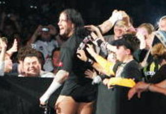 SYDNEY, AUSTRALIA - JUNE 15:  CM Punk celebrates with fans before facing Shelton Benjamin during WWE Smackdown at Acer Arena on June 15, 2008 in Sydney, Australia.  (Photo by Gaye Gerard/Getty Images)