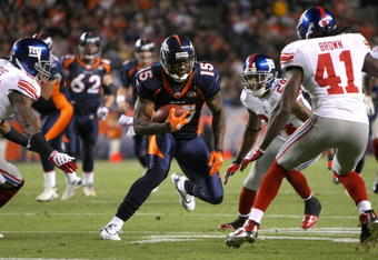 DENVER - NOVEMBER 26:  Wide receiver Brandon Marshall #15 of the Denver Broncos makes a pass reception before being corralled by Aaron Rouse #26, Terrell Thomas #24 and C.C. Brown #41 of the New York Giants during NFL action at Invesco Field at Mile High on November 26, 2009 in Denver, Colorado.  (Photo by Doug Pensinger/Getty Images)