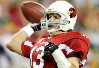 GLENDALE, AZ - JANUARY 10: Quarterback Kurt Warner #13 of the Arizona Cardinals throws a touchdown during the fourth quarter of the 2010 NFC wild-card playoff game against the Green Bay Packers at University of Phoenix Stadium on January 10, 2010 in Glendale, Arizona. (Photo by Christian Petersen/Getty Images)
