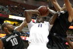 ANAHEIM, CA - DECEMBER 12:  Matthew Bryan-Amaning #11 of the Washington Huskies goes up to shoot between Julian Vaughn #22 and Greg Monroe #10 of the Georgetown Hoyas in the John Wooden Classic on December 12, 2009 at the Honda Center in Anaheim, California. (Photo by Stephen Dunn/ Getty Images)