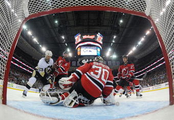 NEWARK, NJ - DECEMBER 30:  Martin Brodeur #30 of the New Jersey Devils records his second straight shutout against Bill Guerin #13 and the Pittsburgh Penguins at the Prudential Center on December 30, 2009 in Newark, New Jersey. The Devils shuy out the Penguins 2-0.  (Photo by Bruce Bennett/Getty Images)