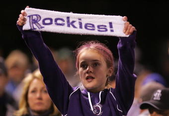 DENVER - OCTOBER 15:  A young fan of the Colorado Rockies holds up a sign in supprt of her team against the Arizona Diamondbacks during Game Four of the National League Championship Series at Coors Field on October 15, 2007 in Denver, Colorado. The Rockies defeated the Diamondbacks 6-4 to sweep the series 4-0.  (Photo by Doug Pensinger/Getty Images)