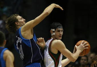 MILWAUKEE - NOVEMBER 16: Ersan Ilyasova #7 of the Milwuakee Bucks looks to pass under pressure from Dirk Nowitzki #41 of the Dallas Mavericks at the Bradley Center on November 16, 2009 in Milwaukee, Wisconsin. The Mavericks defeated the Bucks 115-113 in overtime. (Photo by Jonathan Daniel/Getty Images)