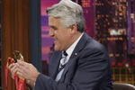 BURBANK, CA - MARCH 1:  In this NBC handout photo, Olympic Gold, Silver and Bronze medal-winning speed skater Chad Hedrick shows off his medals and fielded questions about the controversy with Shani Davis with host Jay Leno during the taping of the 'Tonight Show With Jay Leno' March 1, 2006 in Burbank, California.  (Photo by Margaret Norton/NBC Universal via Getty Images)