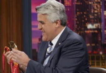 BURBANK, CA - MARCH 1:  In this NBC handout photo, Olympic Gold, Silver and Bronze medal-winning speed skater Chad Hedrick shows off his medals and fielded questions about the controversy with Shani Davis with host Jay Leno during the taping of the 'Tonight Show With Jay Leno' March 1, 2006 in Burbank, California.  (Photo by Margaret Norton/NBC Universal via Getty Images)