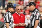 PASADENA, CA - JANUARY 01:  Head coach Jim Tressel of the Ohio State Buckeyes speaks with the referees prior to the 96th Rose Bowl game against the Oregon Ducks on January 1, 2010 in Pasadena, California.  (Photo by Stephen Dunn/Getty Images)