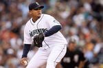 SEATTLE - AUGUST 12:  Felix Hernandez #34 of the Seattle Mariners pitches during the game against the Chicago White Sox on August 12, 2009 at Safeco Field in Seattle, Washington. (Photo by Otto Greule Jr/Getty Images) 
