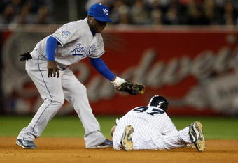 NEW YORK - SEPTEMBER 30: Yuniesky Betancourt #3 of the Kansas City Royals tags out Freddy Guzman #47 of the New York Yankees at second base during the game on September 30, 2009 at Yankee Stadium in the Bronx borough of New York City. (Photo by Jared Wickerham/Getty Images)