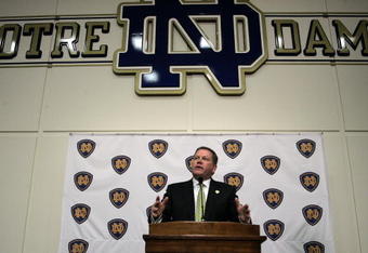 SOUTH BEND, IN - DECEMBER 11: Brian Kelly attends a press conference where he was named new football head coach at Notre Dame University on December 11, 2009 in South Bend, Indiana.  Kelly most recently led the University of Cincinnati to two consecutive Bowl Championship Series appearances including a perfect 12-0 record this past season. (Photo by Frank Polich/Getty Images)
