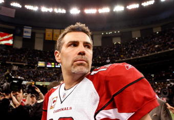 NEW ORLEANS - JANUARY 16:  Quarterback Kurt Warner #13 of the Arizona Cardinals looks on as he stands on the field after their 45-14 loss against the New Orleans Saints during the NFC Divisional Playoff Game at Louisana Superdome on January 16, 2010 in New Orleans, Louisiana.  (Photo by Ronald Martinez/Getty Images)