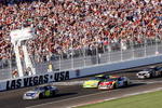 LAS VEGAS - MARCH 11:  Jimmie Johnson, driver of the #48 Lowe's Chevrolet, leads the field after a green flag re-start, during the NASCAR Nextel Cup Series UAW-DaimlerChrysler 400 at Las Vegas Motor Speedway on March 11, 2007 in Las Vegas, Nevada.  (Photo by Chris Graythen/Getty Images for NASCAR)