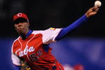 MEXICO CITY - MARCH 10:  Aroldis Chapman #52 of Cuba pitches against Australia during the first inning of the game during the 2009 World Baseball Classic Pool B match on March 10, 2009 at the Estadio Foro Sol in Mexico City, Mexico.  (Photo by Kevork Djansezian/Getty Images)