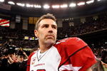 NEW ORLEANS - JANUARY 16:  Quarterback Kurt Warner #13 of the Arizona Cardinals looks on as he stands on the field after their 45-14 loss against the New Orleans Saints during the NFC Divisional Playoff Game at Louisana Superdome on January 16, 2010 in New Orleans, Louisiana.  (Photo by Ronald Martinez/Getty Images)