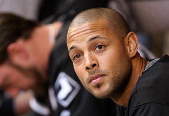 SEATTLE  - AUGUST 12:  Alex Rios #51 of the Chicago White Sox looks on from the dugout during the game against the Seattle Mariners on August 12, 2009 at Safeco Field in Seattle, Washington. (Photo by Otto Greule Jr/Getty Images)