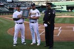 OAKLAND, CA - APRIL 10:  Jason Giambi #16 and Eric Chavez #3 of the Oakland Athletics present a plaque to Oakland Police Chief Howard Jordan, honoring four officers who were slain last month, before the Seattle Mariners and the Oakland Athletics Opening Day Major League Baseball game on April 10, 2009 at the Oakland Coliseum in Oakland, California.  (Photo by Jed Jacobsohn/Getty Images)