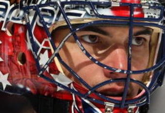 UNIONDALE, NY - OCTOBER 24:  Jose Theodore #60 of the Washington Capitals looks on against the New York Islanders on October 24, 2009 at Nassau Coliseum in Uniondale, New York. The Capitals won the game 3-2 in overtime.  (Photo by Jim McIsaac/Getty Images)