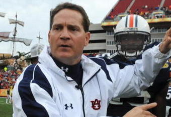 TAMPA, FL - JANUARY 1: Coach Gene Chizik of the Auburn Tigers moves players from the field before overtime against the Northwestern Wildcats in the Outback Bowl January 1, 2010 at Raymond James Stadium in Tampa, Florida.  (Photo by Al Messerschmidt/Getty Images)
