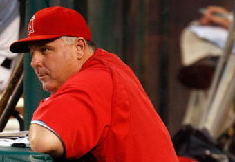 ANAHEIM, CA - AUGUST 10:  Los Angeles Angels of Anaheim manager Mike Scioscia looks on from the dugout against the Tampa Bay Rays at Angel Stadium on August 10, 2009 in Anaheim, California.  (Photo by Jeff Gross/Getty Images)