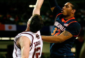 ATLANTA - MARCH 12:  Mike Scott #32 of the Virginia Cavaliers shoots over Joe Trapani #12 of the Boston College Eagles during day one of the 2009 ACC Men's Basketball Tournament on March 12, 2009 at the Georgia Dome in Atlanta, Georgia.  (Photo by Kevin C. Cox/Getty Images)