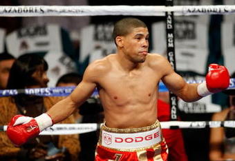 LAS VEGAS - DECEMBER 06:  (L-R) Juan Manuel Lopez of Puerto Rico reacts after knocking out Sergio Medina of Argentina during their WBO junior featherweight title fight at the MGM Grand Garden Arena December 6, 2008 in Las Vegas, Nevada.  (Photo by Ethan Miller/Getty Images)