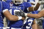 DETROIT - DECEMBER 05: James Starks #19 of the Buffalo Bulls celebrates a fourth quarter touchdown with Chris Lauzze #79, Andrew West #72 and Peter Bittner #73 while playing the Ball State Cardinals during the second quarter of the MAC Championship game on December 5, 2008 at Ford Field in Detroit, Michigan. (Photo by Gregory Shamus/Getty Images)