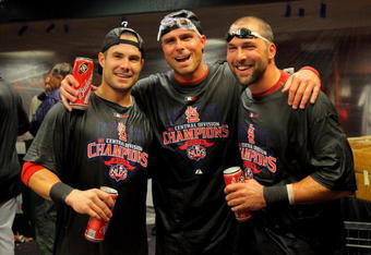 DENVER - SEPTEMBER 26:  (L-R) Skip Schumaker, Rick Ankiel and Mark DeRosa of the St. Louis Cardinals celebrate in the clubhouse after clinching the National League Central Division by defeating the Colorado Rockies at Coors Field on September 26, 2009 in Denver, Colorado. The Cardinals defeated the Rockies 6-3.  (Photo by Doug Pensinger/Getty Images)