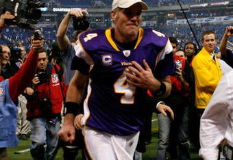 MINNEAPOLIS - JANUARY 17:  Quarterback Brett Favre #4 of the Minnesota Vikings runs off the field after defeating the Dallas Cowboys 34-3 during the NFC Divisional Playoff Game at Hubert H. Humphrey Metrodome on January 17, 2010 in Minneapolis, Minnesota.  (Photo by Elsa/Getty Images)