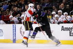 LOS ANGELES, CA - DECEMBER 07:  Dion Phaneuf #3 of the Calgary Flames hits Justin Williams #14 of the Los Angeles Kings in the second period at Staples Center on December 7, 2009 in Los Angeles, California.  (Photo by Jeff Gross/Getty Images)